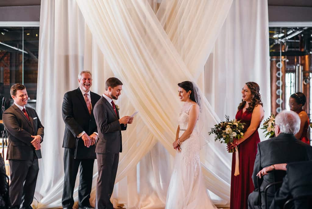 couple reading their vows to one another